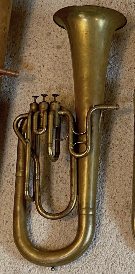 An upright Bb baritone in raw brass with 3 top action berliner pumpen valves