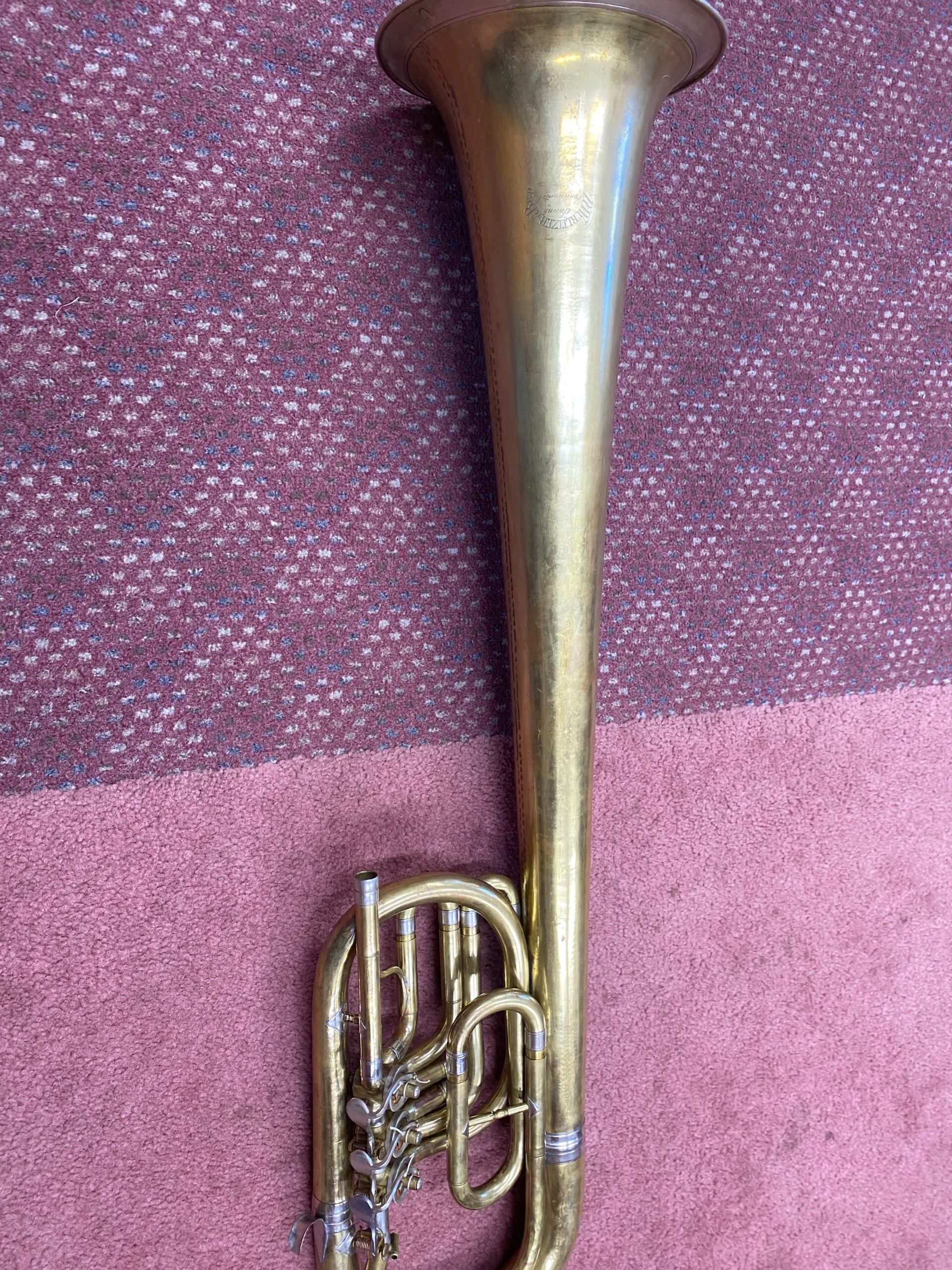 Bb baritone in brass with over-the-shoulder bell design and top-action rotary valves