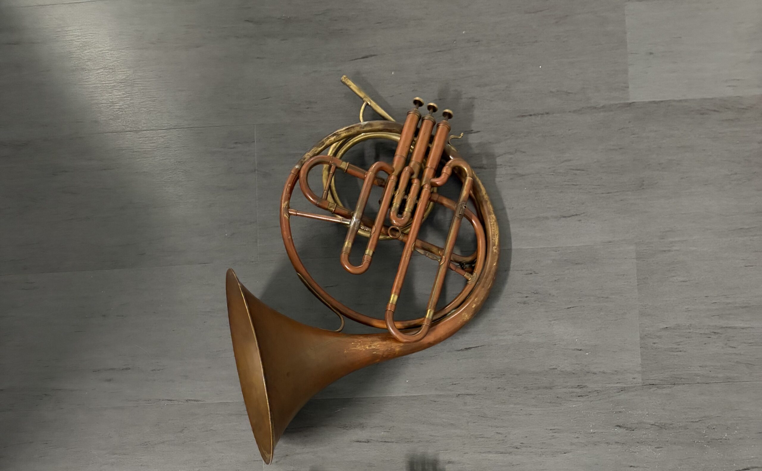 Eb french horn with long piston valves and red patina