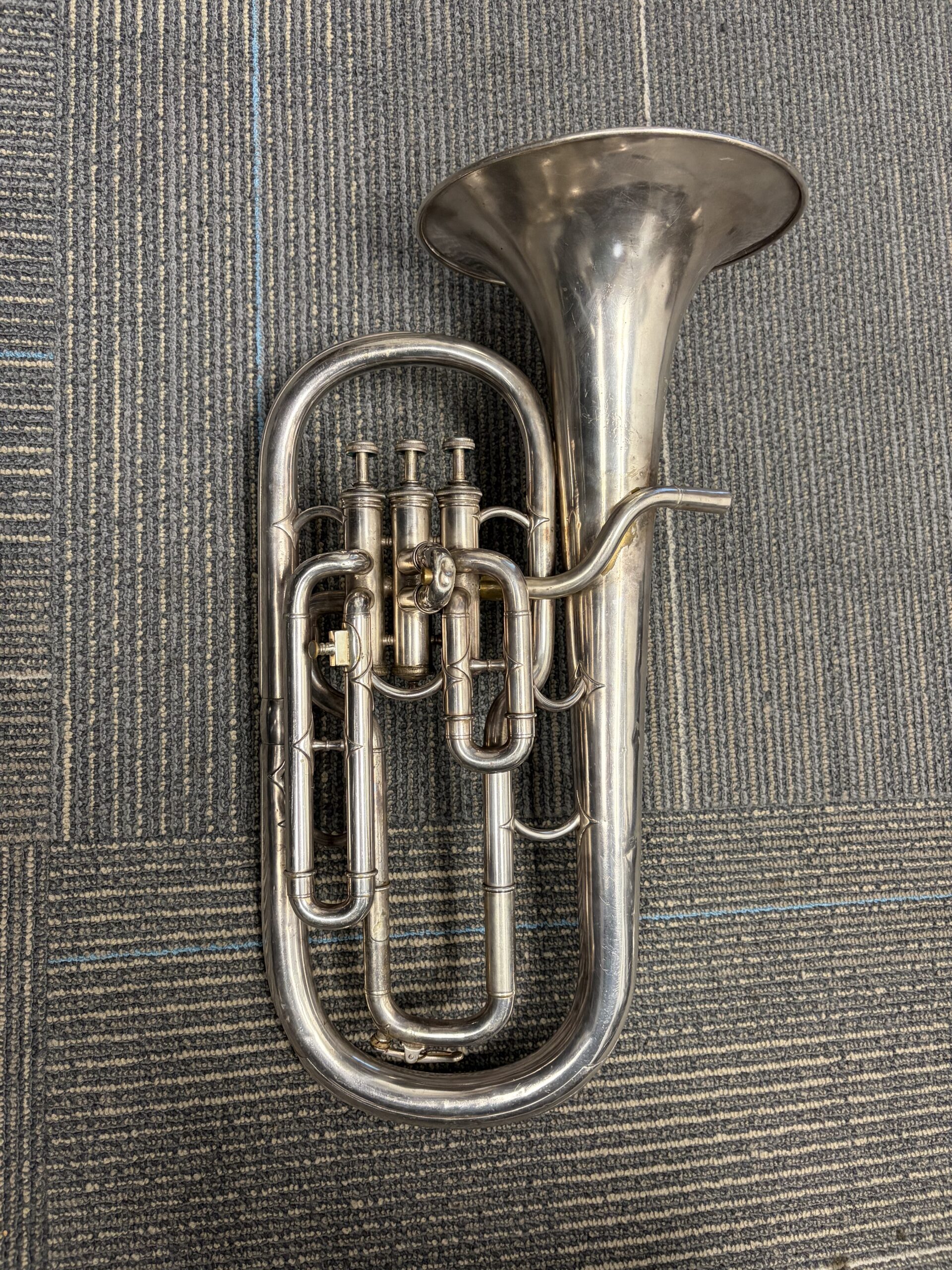 A silver plated Eb alto horn with three top action piston valves